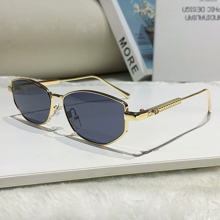 Dame elegant solbrille med glitrende metallramme Skanto