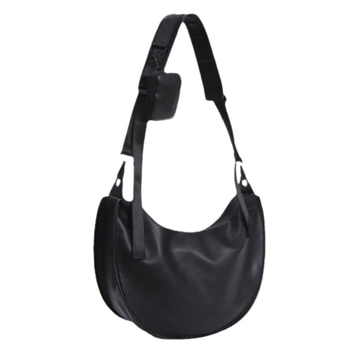 Elegant skulderveske i buet form Skanto
