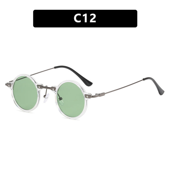 Dame rund solbrille med moderne metallramme og store blå linser Skanto