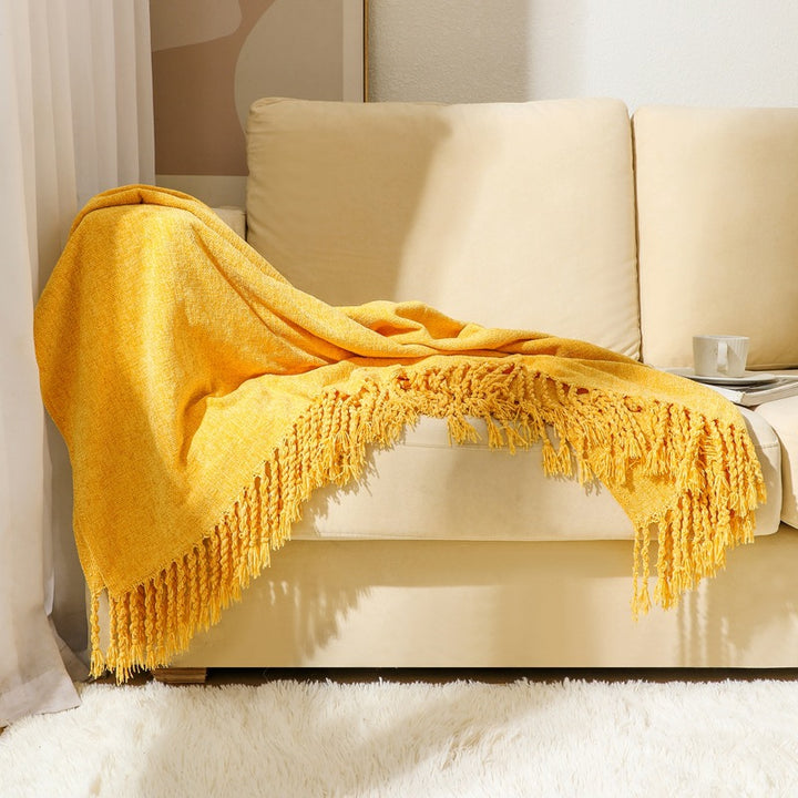 Kvinnelig elegant og stilfull sofa teppe med frynser Skanto