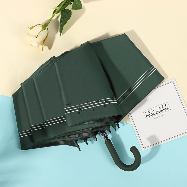 Dame kompakt sammenleggbart regnparaply med elegant design og ergonomisk tremanor Skanto