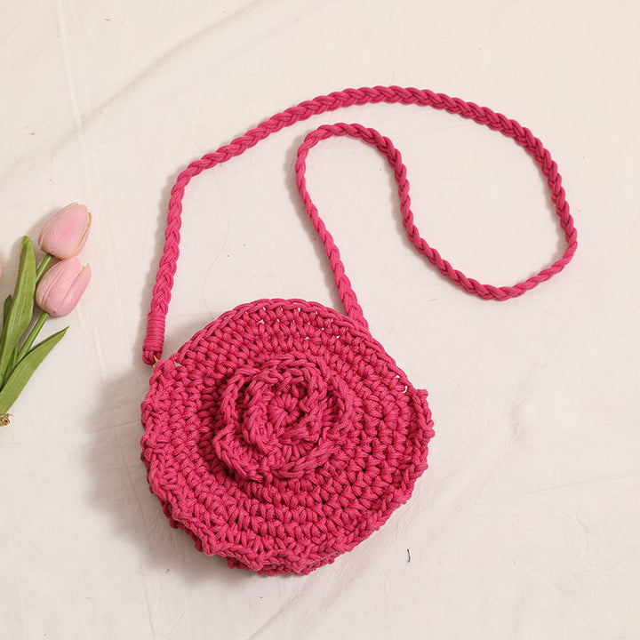 Håndheklede crossover-veske med florale detaljer Skanto
