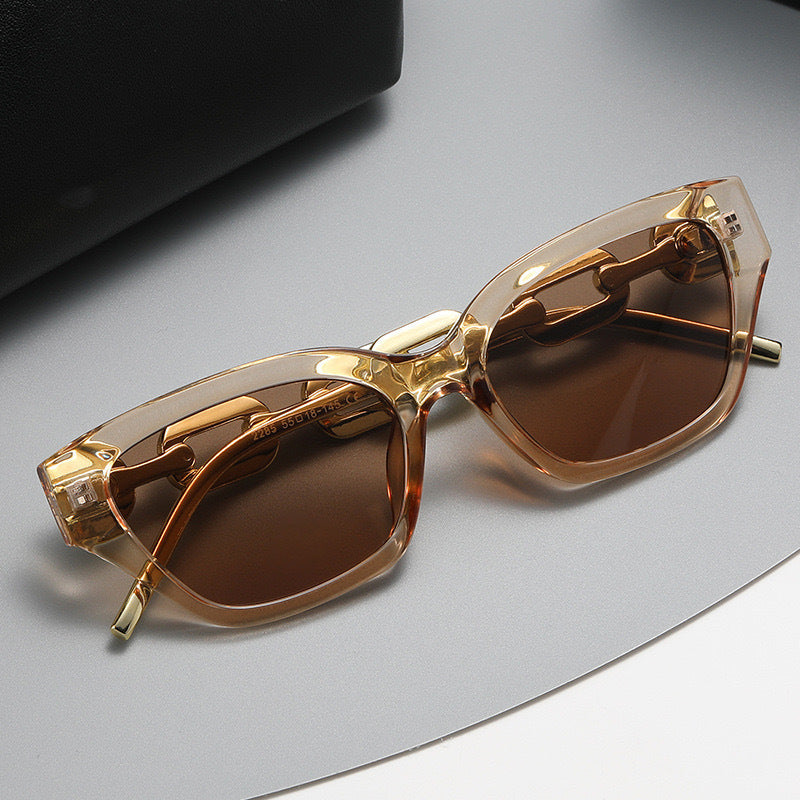 Dame solbrille med unikt kjededesign Skanto