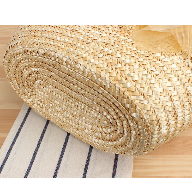 Elegant straw bag with floral accents Skanto