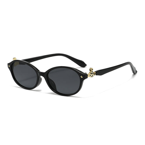 Dame motekunstig brille i elegant ova-design med gyldne aksenter Skanto
