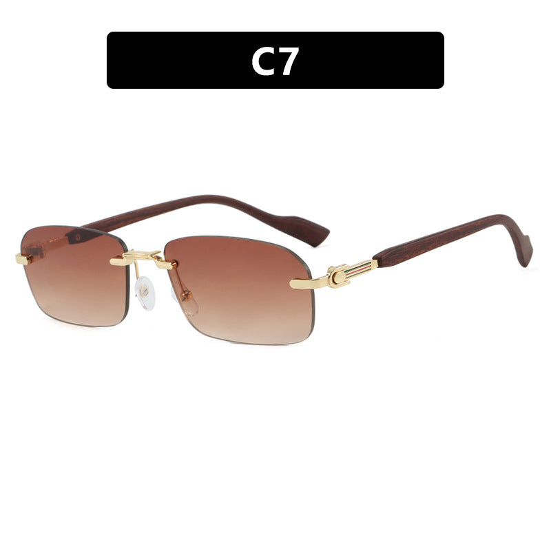 Dame solbrille med elegant metallramme og stilige tre detaljer Skanto