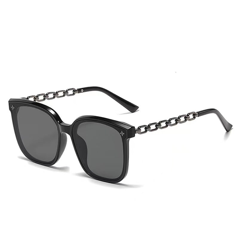 Dame ekstrastor solbrille med modig kjedeinnramming Skanto