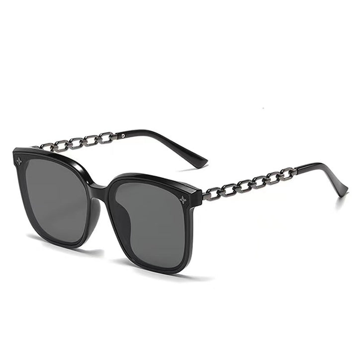 Dame ekstrastor solbrille med modig kjedeinnramming Skanto