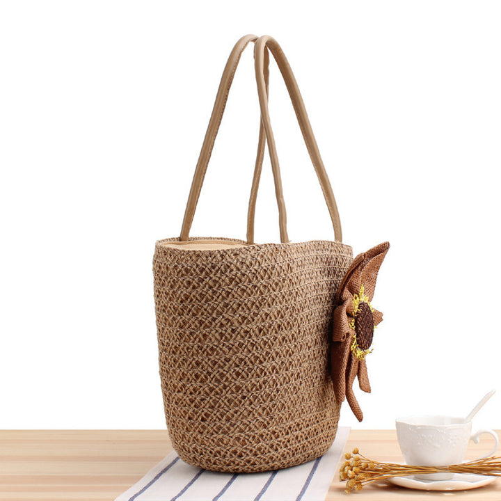 Handbag with floral appliqué in natural material Skanto