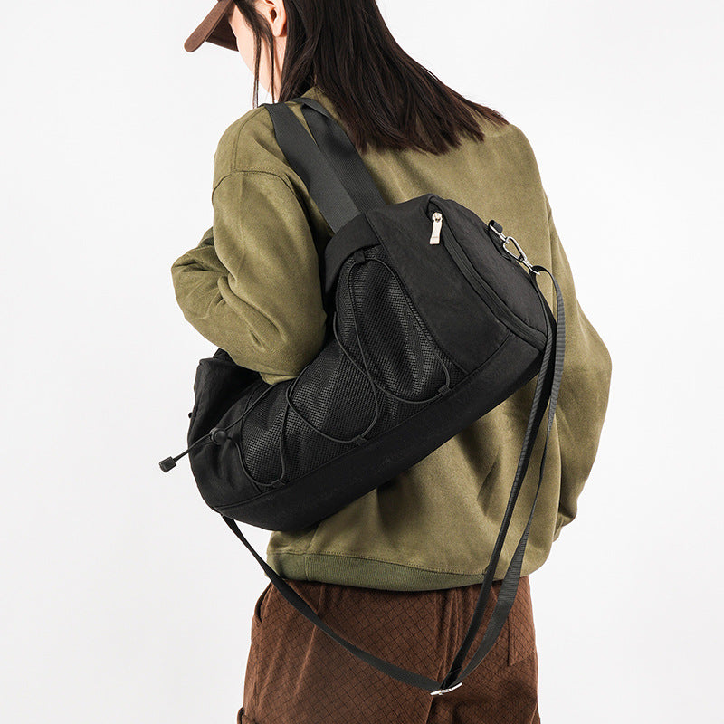 Sporty crossbody bag with adjustable carrying handles and breathable mesh material Skanto
