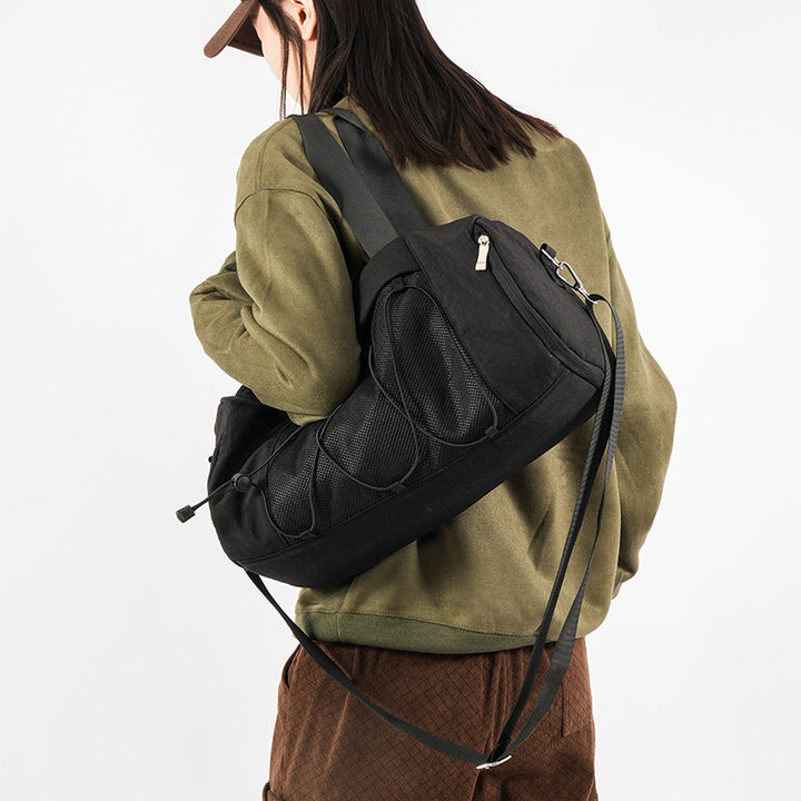 Sporty crossbody bag with adjustable carrying handles and breathable mesh material Skanto