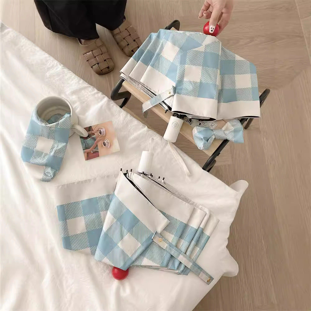 Dame sammenleggbart paraply med spesiell design Skanto