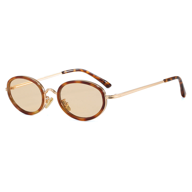 Dame elegant rund solbrille med moderne metallramme Skanto