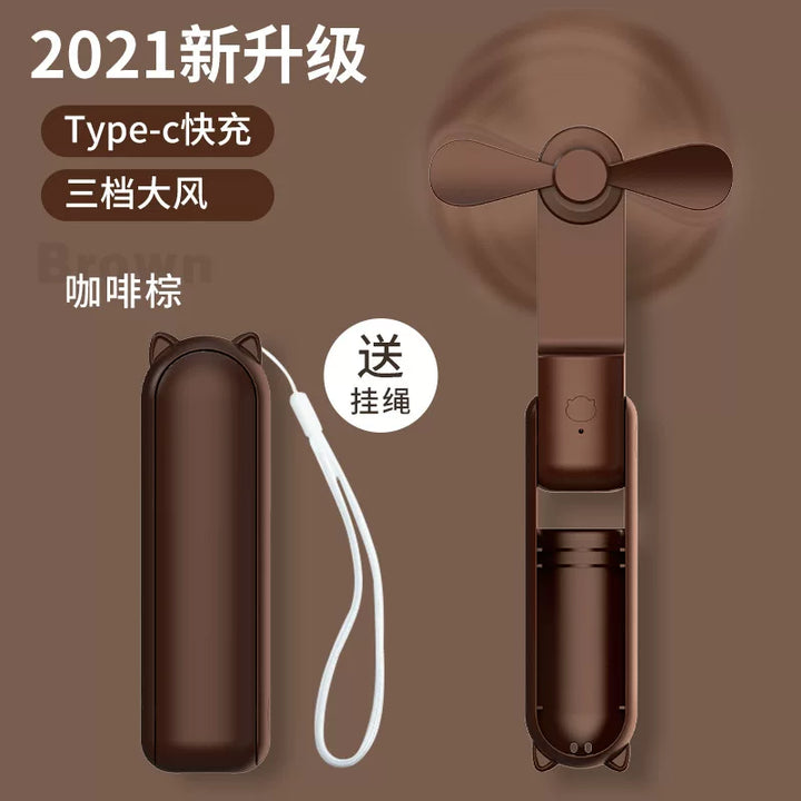 Unisex en størrelse sammenleggbar oppladbar trippel håndholdt mini vifte med innebygd powerbank USB-C og USB-A tilkoblinger samt håndleddsstropp Skanto