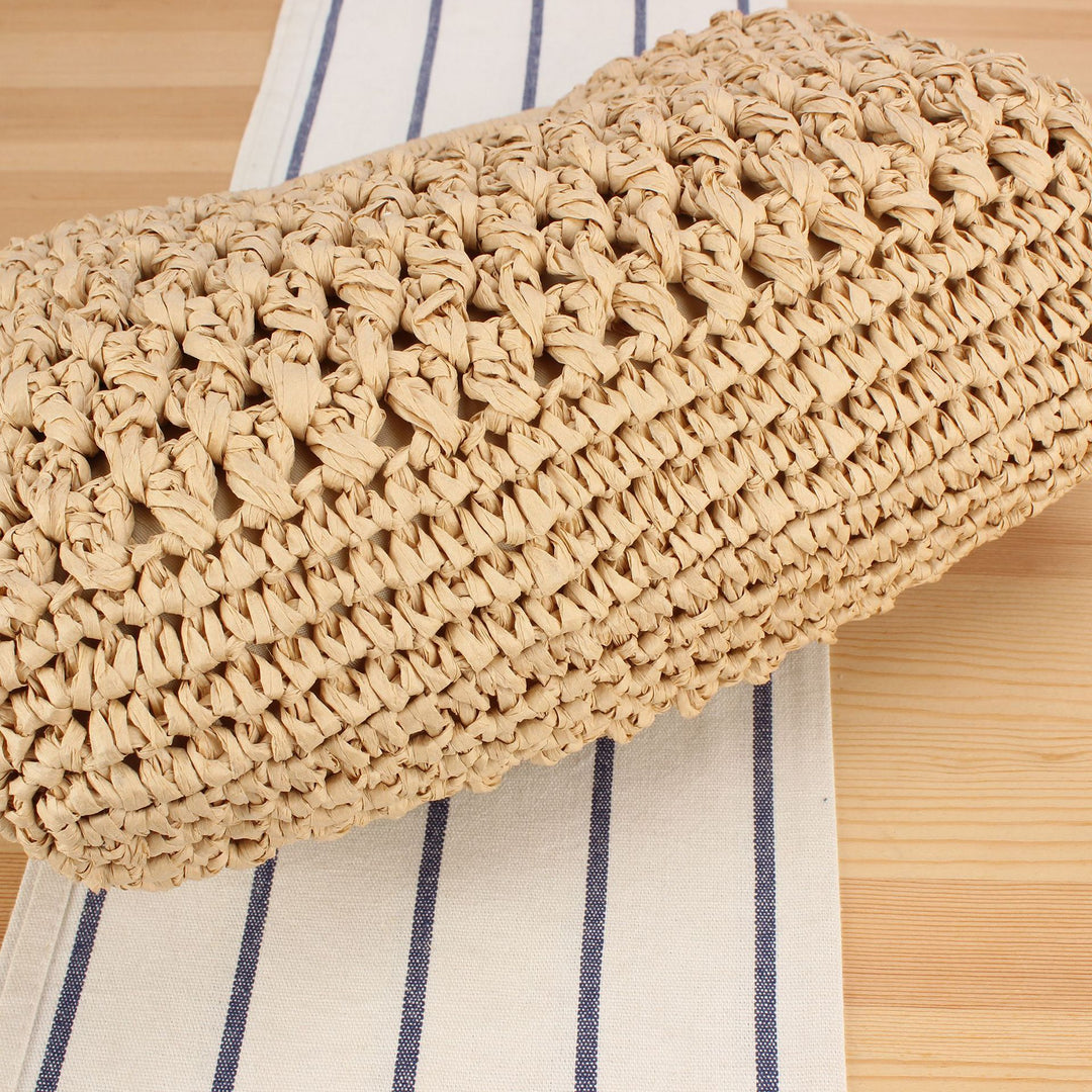 Handbag made of naturally coated braided material with elegant chain detail Skanto
