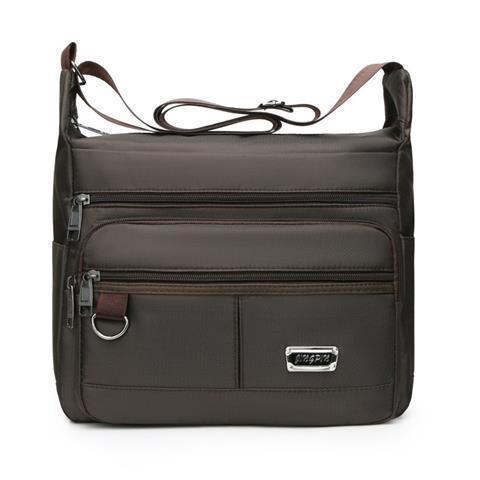 Praktisk crossbody-veske med multifunksjonelt fagssystem Skanto