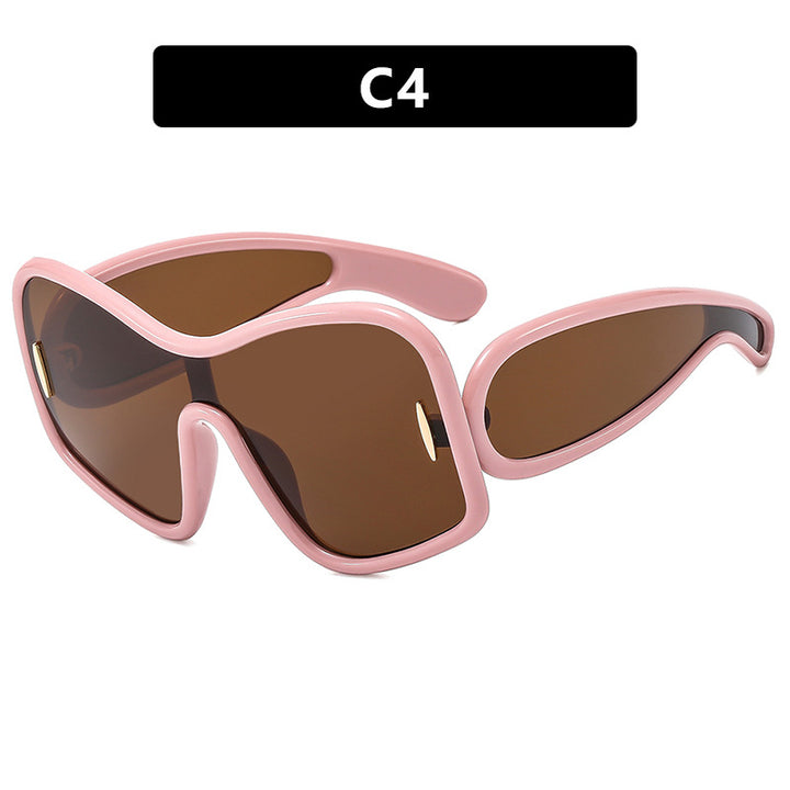 Dame futuristisk solbrille med ekstra bred design og beskyttende UV-filter Skanto