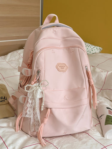 Detaljert brodert skole ryggsekk