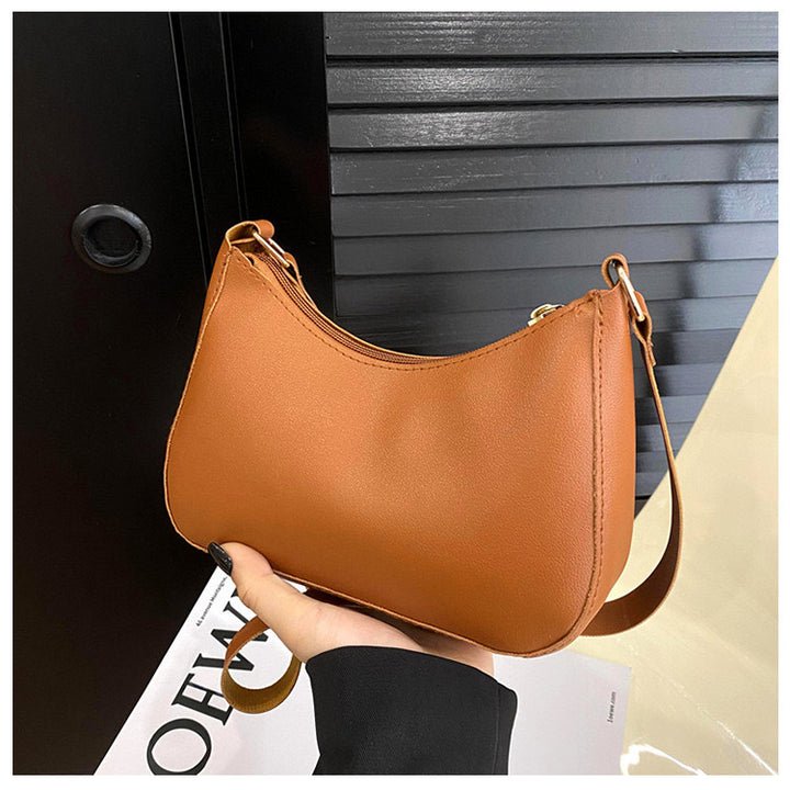 Elegant håndveske i bølget design Skanto