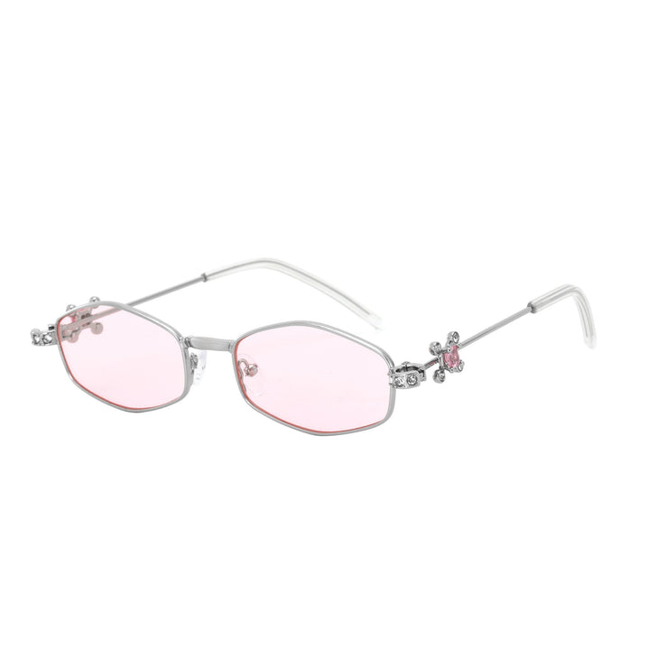 Dame Designer-solbrille med elegant smykkeinnramming Skanto