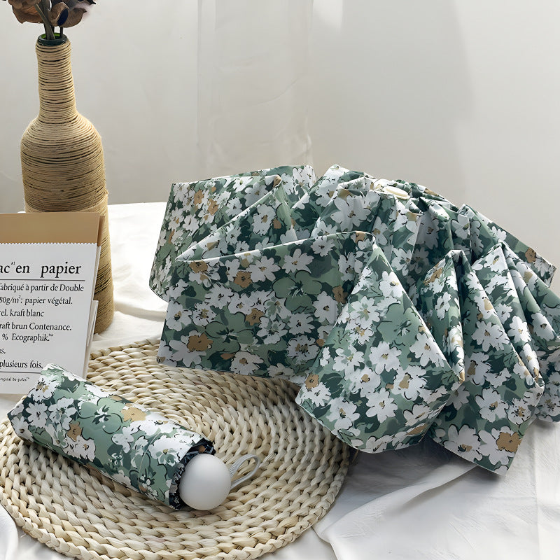 Damer Sammenleggbart paraply med elegant blomsterdesign Skanto