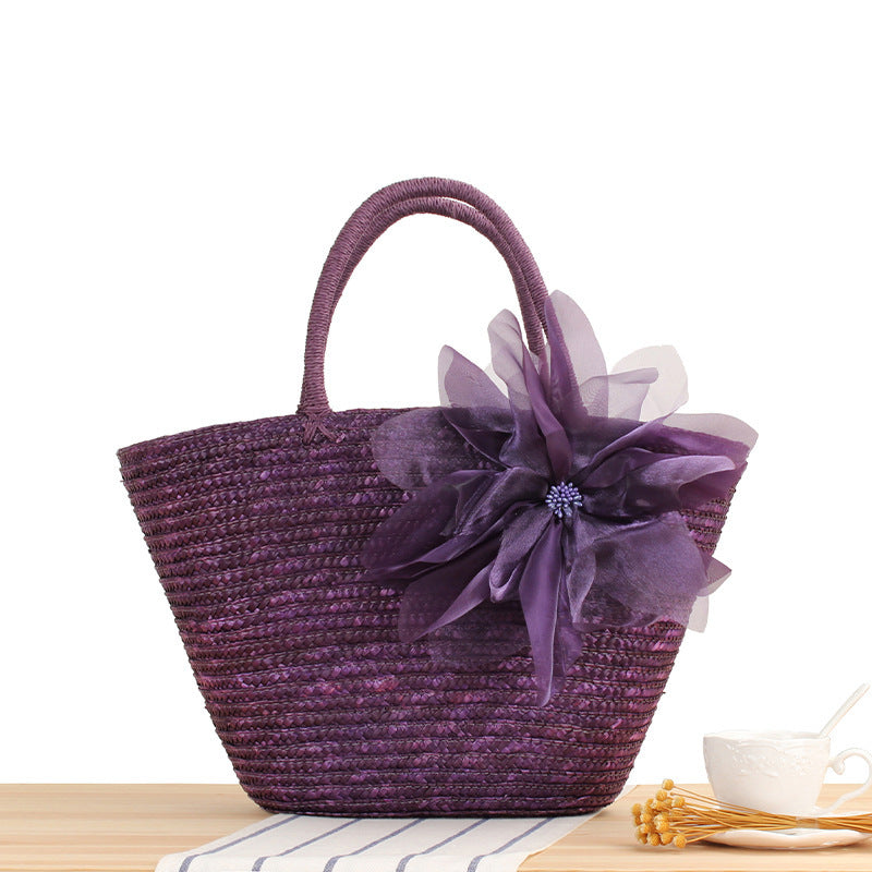 Elegant straw bag with floral accents Skanto