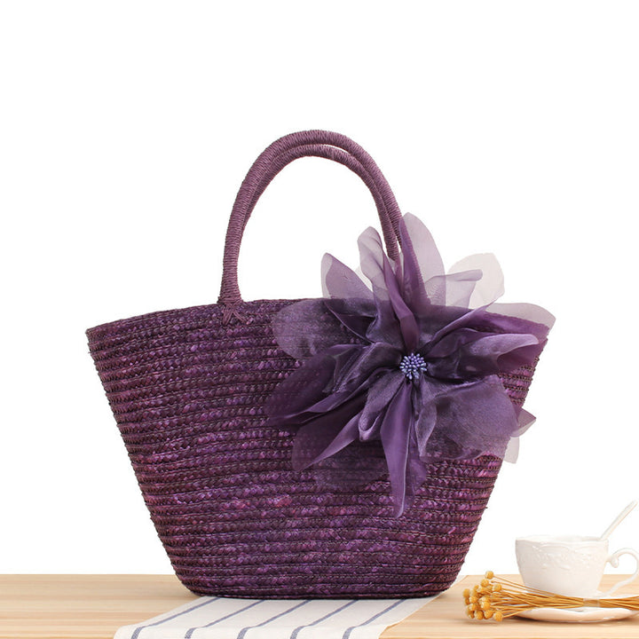 Elegant straw bag with floral accents Skanto