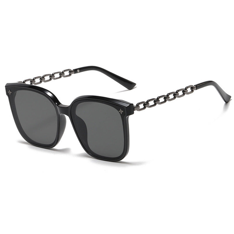 Dame ekstrastor solbrille med modig kjedeinnramming Skanto