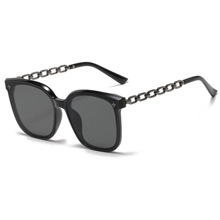 Dame ekstrastor solbrille med modig kjedeinnramming Skanto