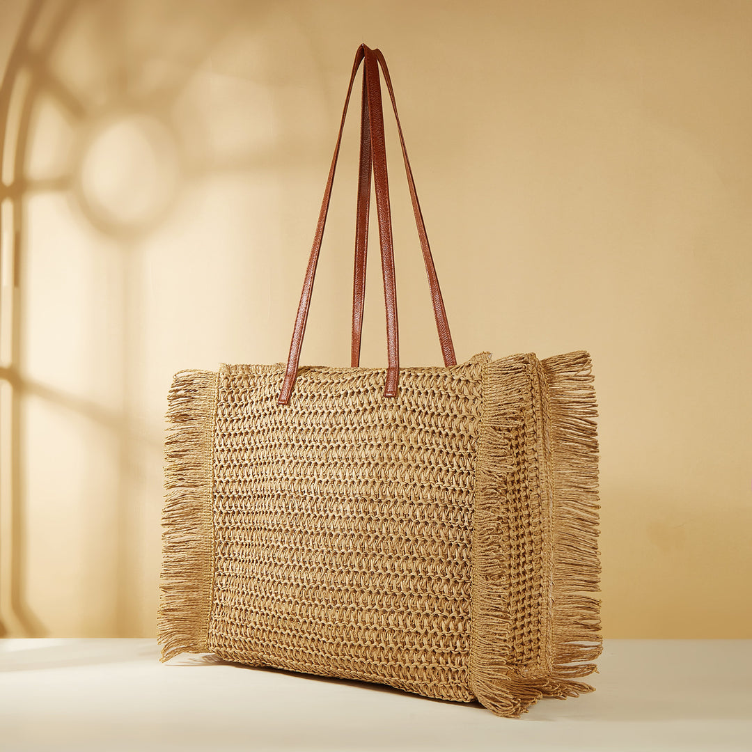 Strandveske i raffia med frynse-detaljer Skanto