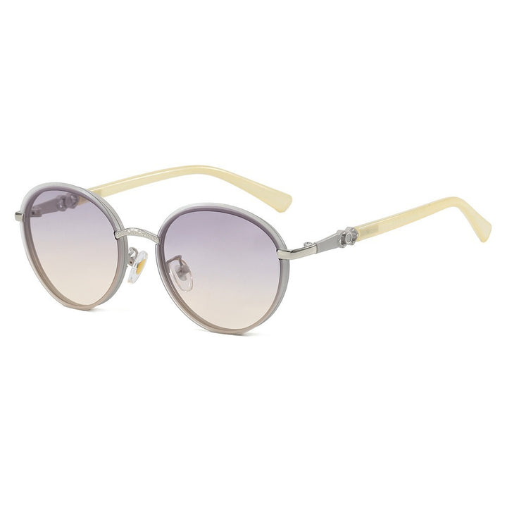 Dame elegant rund solbrille med speilende effekt Skanto