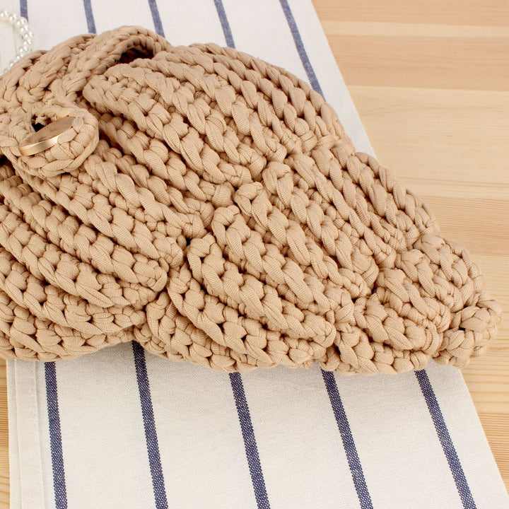 Elegant håndveske i muslingdesign Skanto
