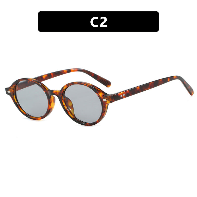 Dame rund solbrille med moderne design og polariserte glass Skanto
