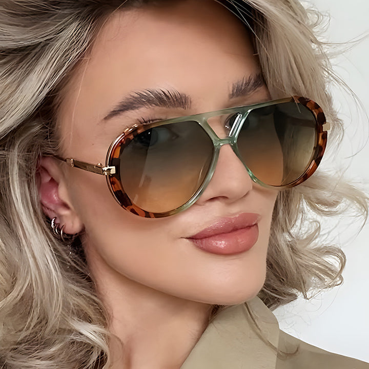 Dame fashionable solbriller i elegant pilotenstil Skanto
