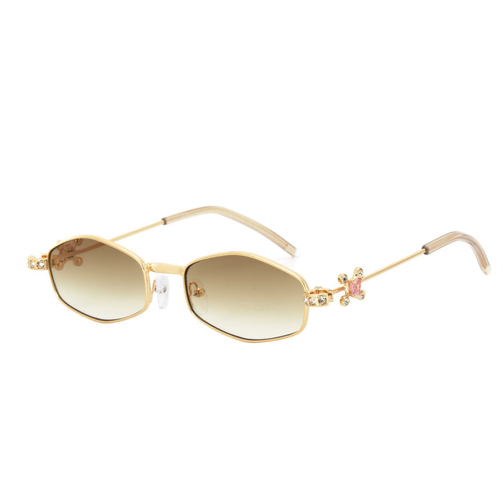 Dame Designer-solbrille med elegant smykkeinnramming Skanto