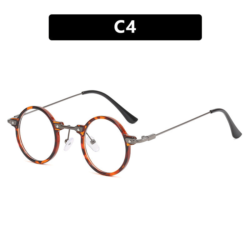 Dame rund solbrille med moderne metallramme og store blå linser Skanto