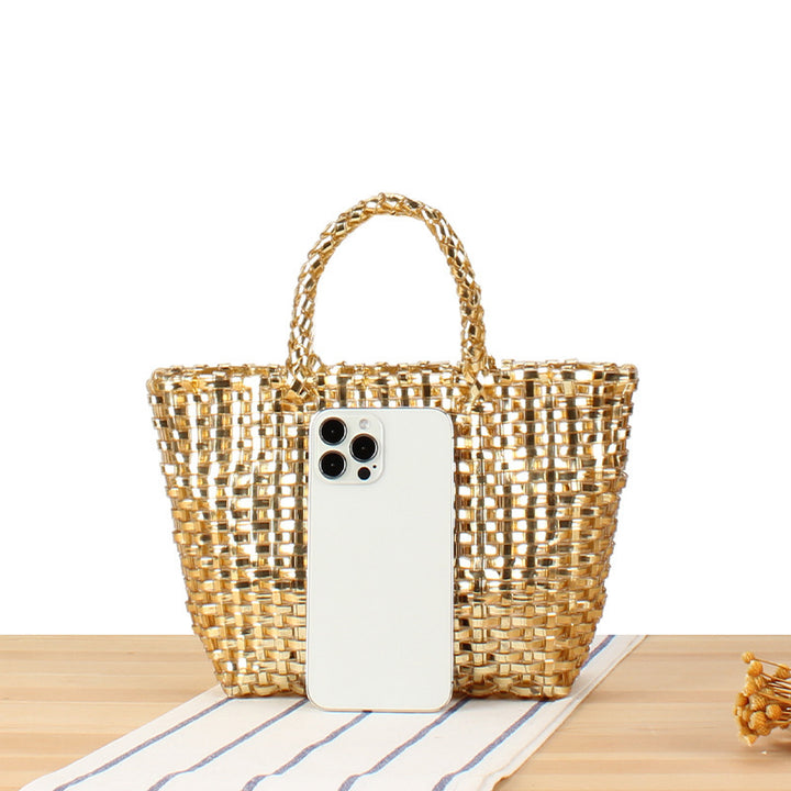 Handbag made of woven natural material with elegant accents Skanto