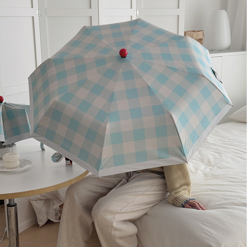 Dame sammenleggbart paraply med spesiell design Skanto