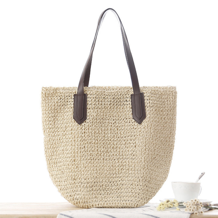 Woven natural material handbag with sturdy leather handles Skanto