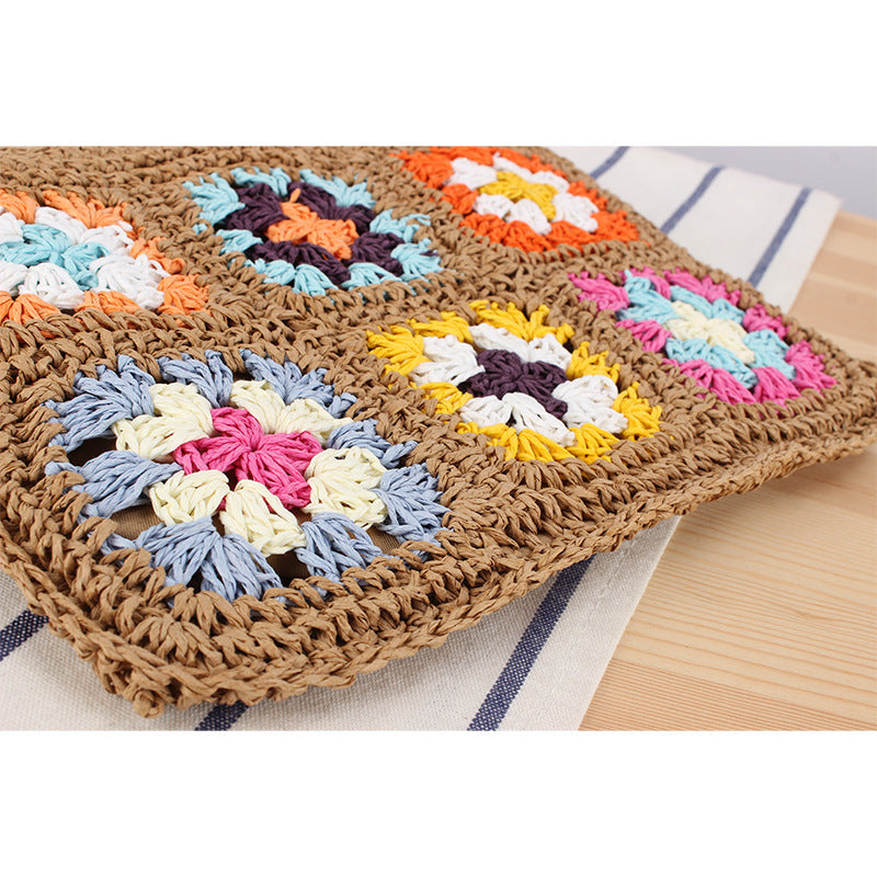 Hand-knotted shoulder bag with colorful floral design Skanto