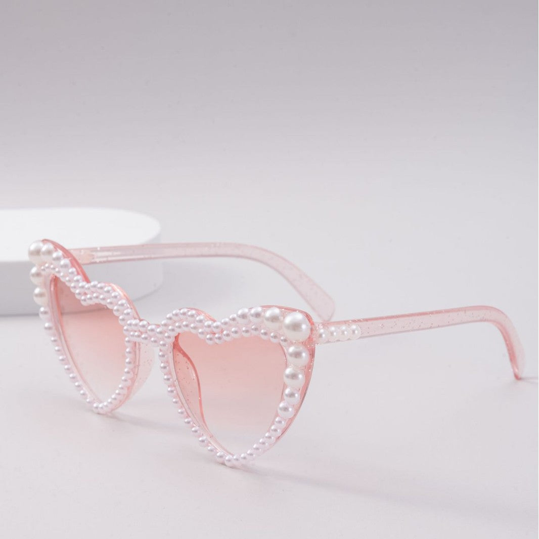 Dame designer solbrille med perleinnramming fra Skanto