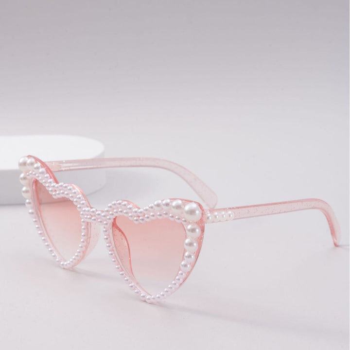 Dame designer solbrille med perleinnramming fra Skanto