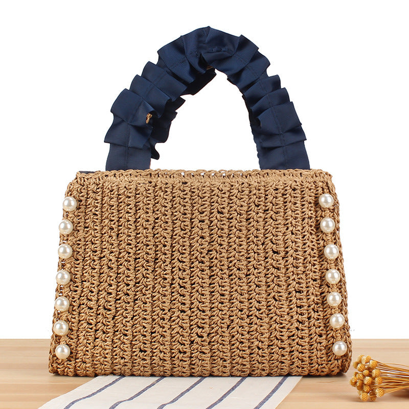 Elegant handbag with beaded decoration and ruffled handle Skanto