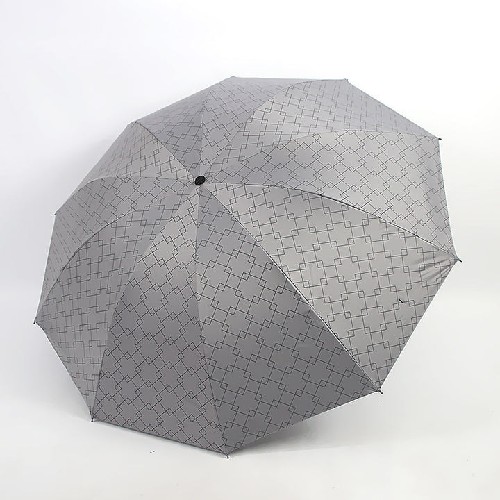 Kvinnenes sammenleggbare paraply med moderne geometrisk mønster Skanto