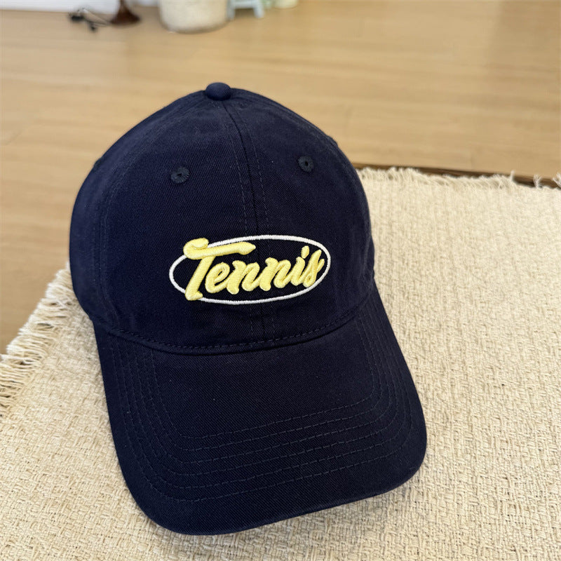 Herresportcaps med tennisgrafikk Skanto