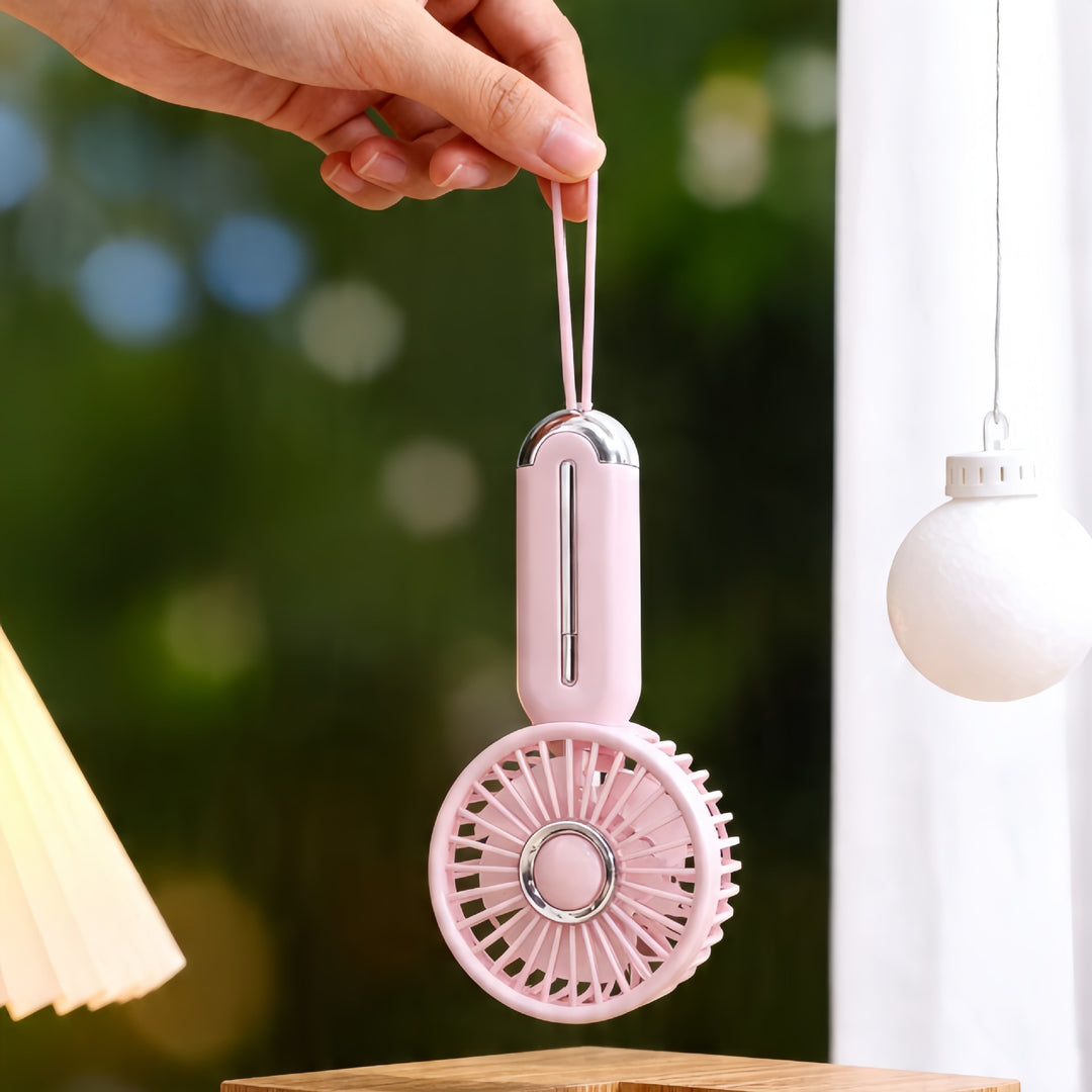 Kvinnelig bærbar håndholdt vifte med USB-ladefunksjon og ergonomisk design Skanto