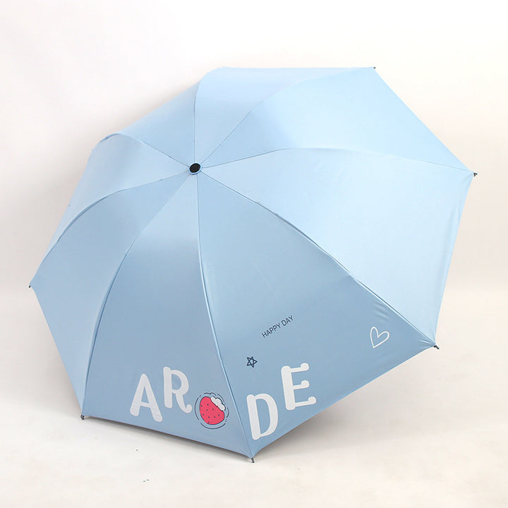 Kvinnens sammenleggbare paraply med lystig design Skanto