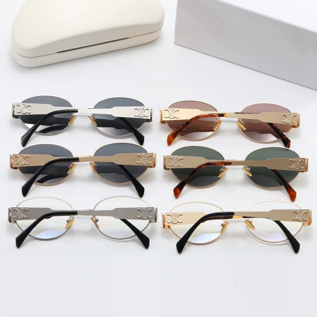 Dame elegant oval solbrille med gullfarget ramme Skanto