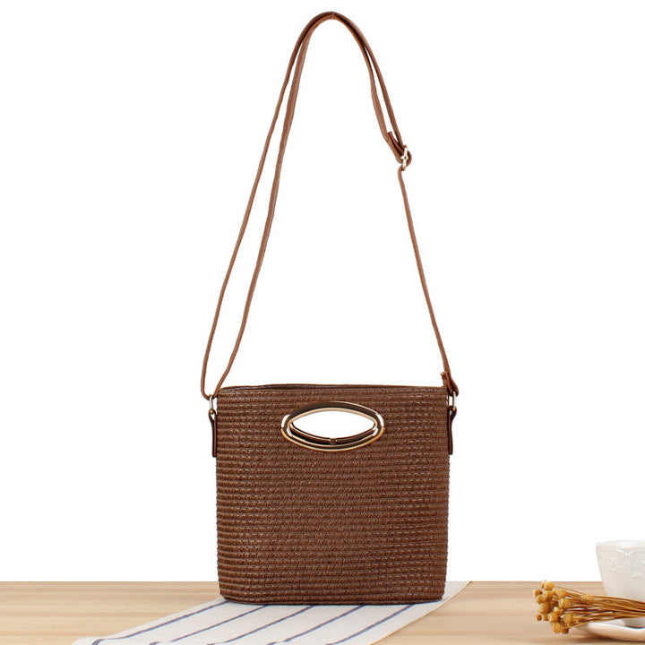 Handwoven natural material crossbody bag with elegant ring clasp Skanto