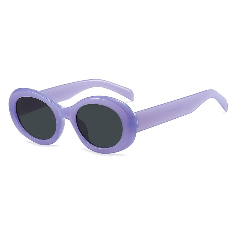 Dame moteriktig solbrille i original oval design med transparent ramme og UV-beskyttelse Skanto